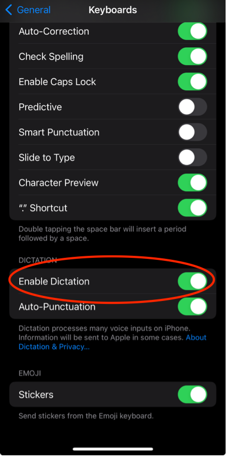 iOS Keyboards settings with Enable Dictation switched on and circled.